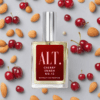 A bottle of perfume surrounded by almonds and cherries.